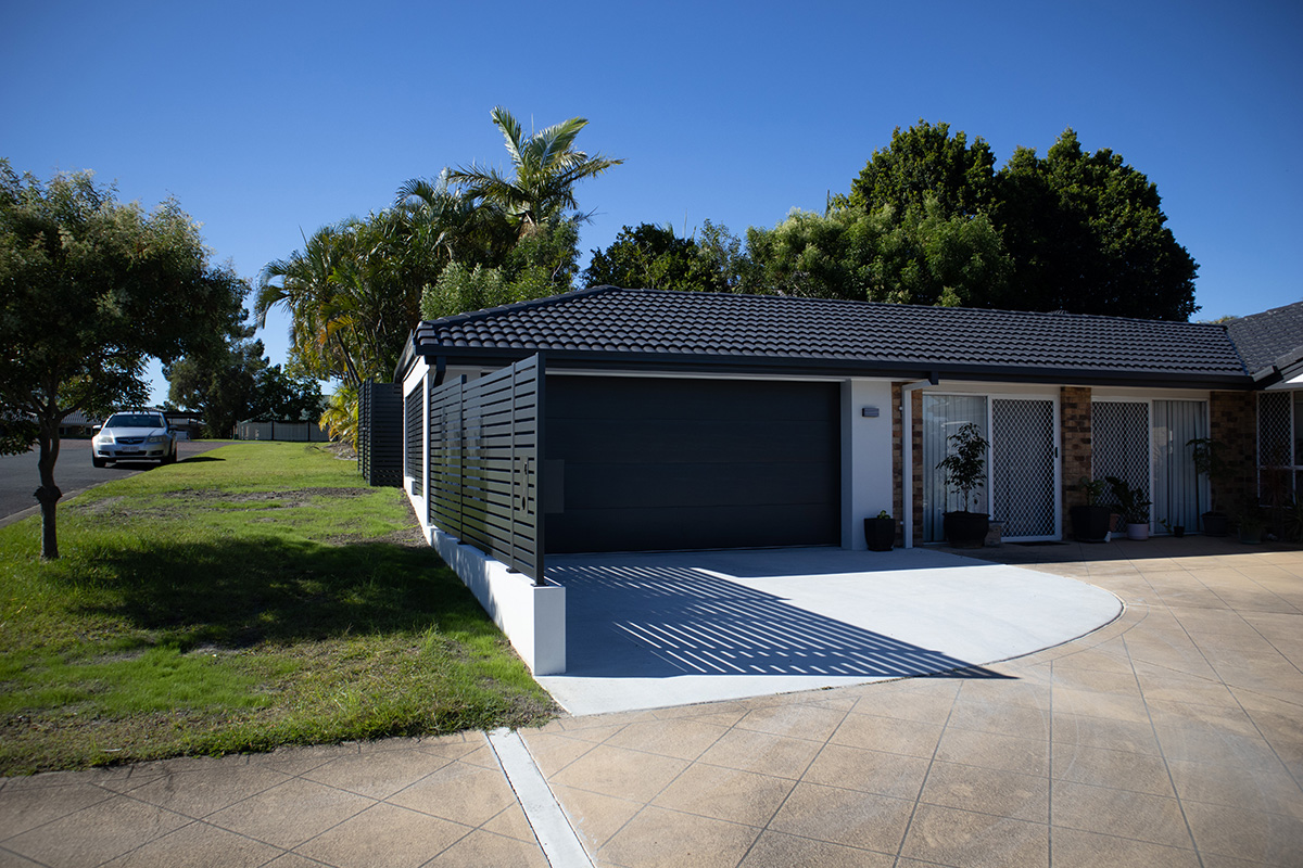 Carport extension with slat screen fencing showing roof extension