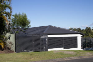 Carport extension with slat screen fencing