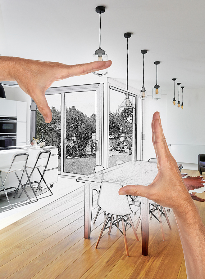 plan-your-renovation A partially colored sketch of a living room concept with hands framing the vision of a design.